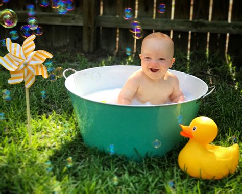 Babies at this age can crawl, pull from a seated position to standing. 1 year old boy milk bath photo session with bubbles and ...