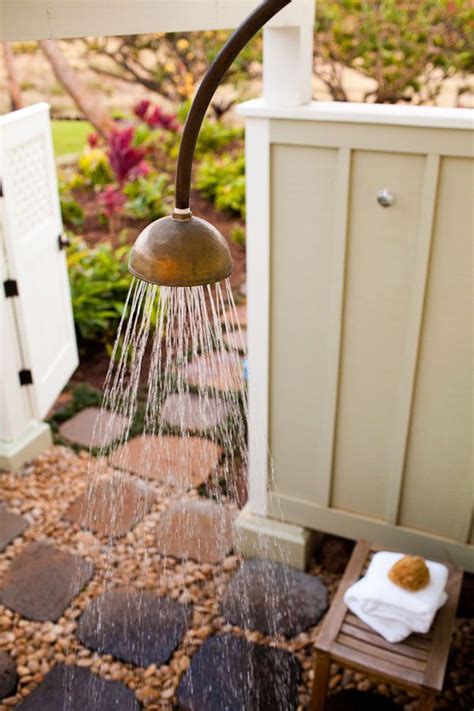 Many people will build a french drain with a curve to make the design look more intentional. Outdoor shower - I like the slate stepping stones with ...