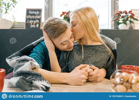Kissing Embracing Young Couple Sitting In Cafe Together Under One Warm Blanket Stock Image ...