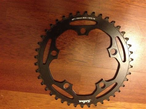 Use the measurement to find your bcd on the table below: Salsa 42T chainring 110 BCD 5 bolt For Sale