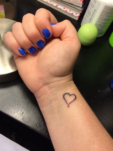 Small heart wrist tattoo | Small heart wrist tattoo, Wrist tattoos for guys, Heart tattoo wrist