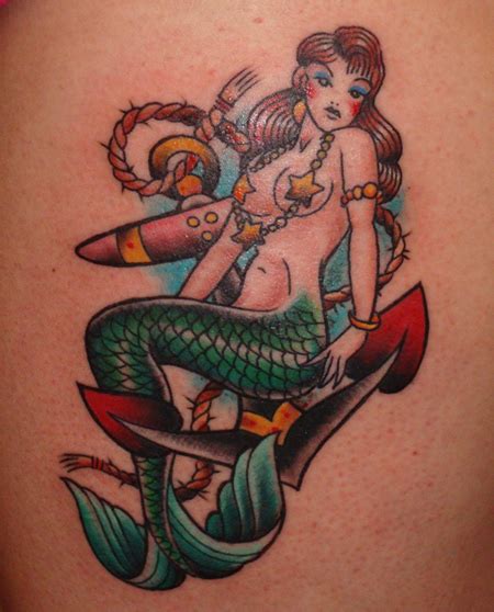 Awesome traditional mermaid with flowers tattoo design for leg calf. 15 Simple and Traditional Mermaid Tattoo Designs