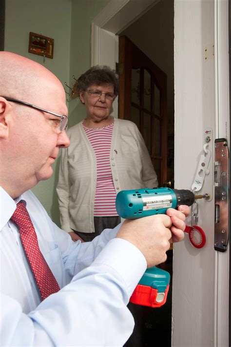 Maybe you would like to learn more about one of these? Alan installing a door security device | Door security ...