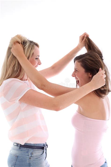 Pull your hair up into a loose bun or ponytail, leaving your baby hairs on display. Young Women Pulling Hair Stock Images - Image: 26483344