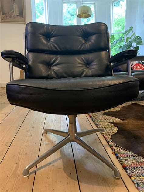 This is not a cheap option but it's still several thousand dollars less than the original. Black 1960s Herman Miller Eames Time Life Lounge Chair (1846) - Eames.com