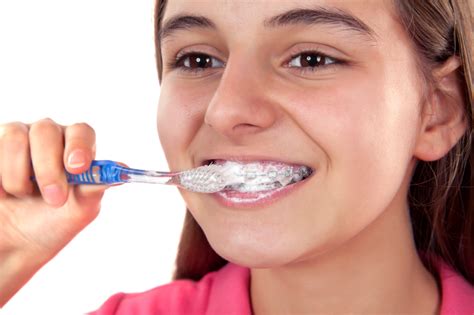 Start by removing loose food particles. Brushing with Braces Tips - Westermeier Martin Dental Care