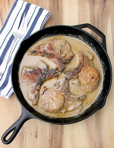Smothered pork chops have met their match! Baked Pork Chops with Cream of Mushroom Soup in a cast-iron skillet.