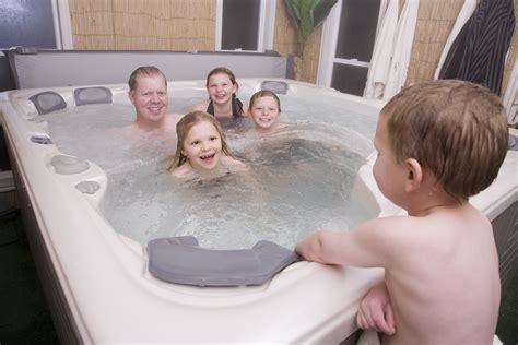 Kids in the hot tub alps kids in hot tub austria summer resort snow children luxury holiday hot tub kid in tub pool snow jacuzzi children. A Hot Tub extends the use of your garden
