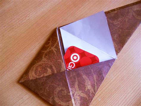 First, you will take your card, make sure it's a busy pattern in colors that you like. How to Make an Origami Gift Card Envelope