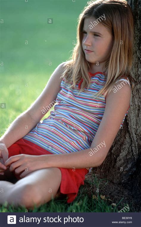 The catalog contains more than 1500 photos from 22 nominations from more than 1000 authors of the 5rd 35awards. Preteen girl sit against tree in park pensive mood Stock ...