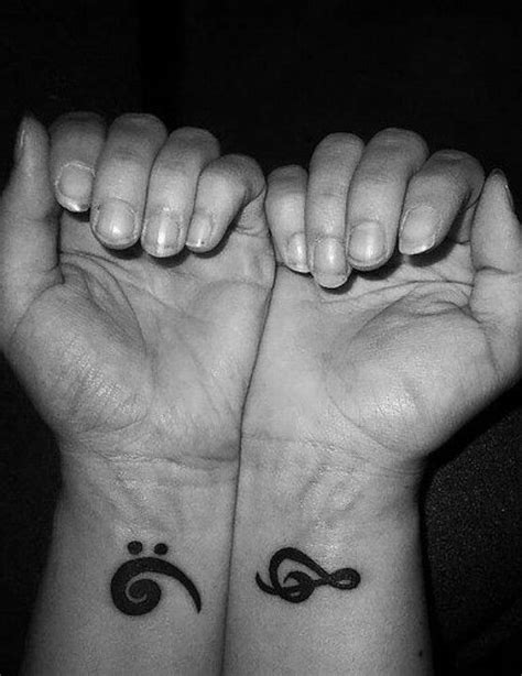 Monochrome treble clef tattoos on the wrist. Pin by April Dollins on Awesome tats | Treble clef tattoo ...