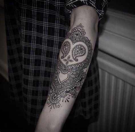 Typically, the artist will use a photograph of the real thing as a reference. Henna inspired tattoo on the left forearm.