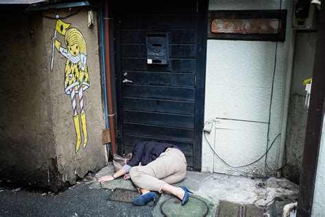 8:49am on mar 05, 2009. A Japanese woman passed out drunk in a dirty Tokyo ...