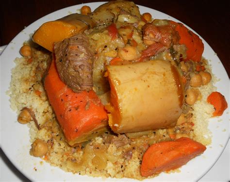 Couscous is a berber dish of small (about 3 millimetres (0.12 in) in diameter) steamed balls of crushed durum wheat semolina that is traditionally served with a stew spooned on top. Moroccan couscous at El Karnak Egyptian Restaurant Astoria ...