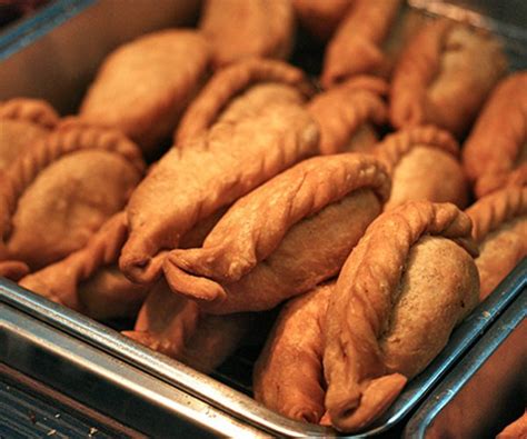 The chain sells more than 40,000 curry puffs daily. Curry puffs are colonial era food. Old Chang Kee making ...