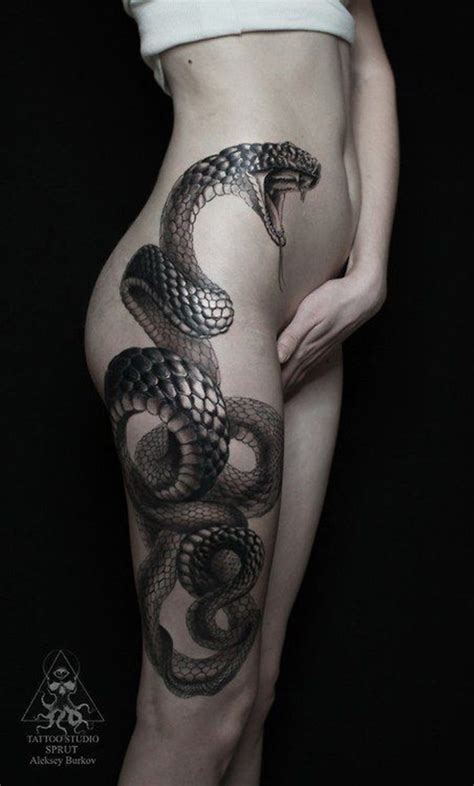 The skeleton looks check out the snake skeleton carved on the chest of the guy. 101 Thigh Tattoo Ideas and Designs for Women