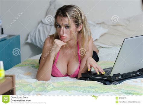 #anal #blonde #blowjobs #cumshots #milf. Busty Brunette Lying On A Bed With A Laptop Stock Image ...