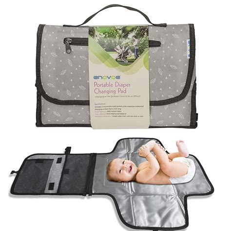 It features a changing pad, storage pockets, and a soft pillow. Portable Diaper Changing Pad for Baby - Convenient, Durable, Waterproof Travel Changing Mat with ...