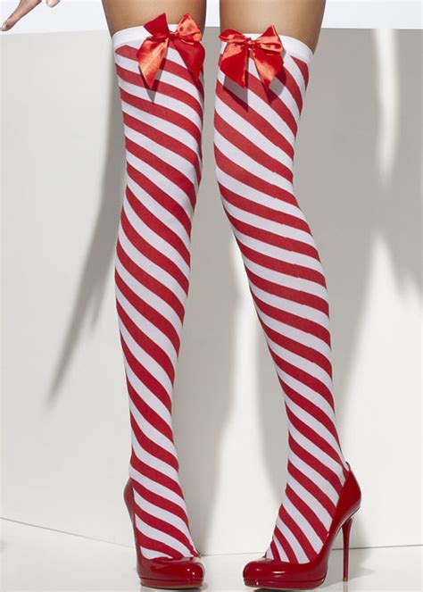 The candy stocking is a red and white striped sock with a green collar. Ladies Christmas Red Candy Stripe Stockings | eBay
