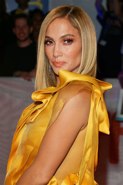 She swept her hair into a stylish updo and completed her look with an emerald green and diamond necklace and matching earrings. Jennifer Lopez Wears Yellow Gown to Hustlers TIFF Premiere ...