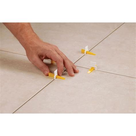 The patented lash system is designed for quick installation and reduces costly call backs by insuring that the finished prevents tile from moving during the installation. QEP Lash Tile Levelling Clips - 100 Pack | Tile leveling ...