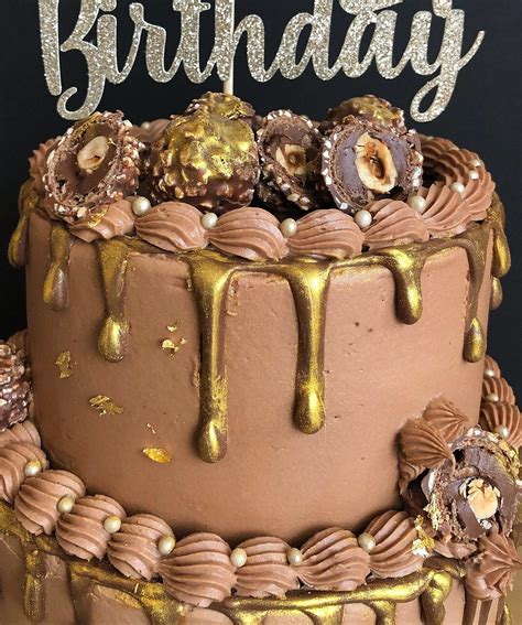 Chocolate hazelnut cake layers and with a nutella buttercream. Ferrero Rocher gold drip cake (With images) | Drip cakes ...