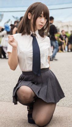 Asian schoolgirl in uniform outside school. Asians in Pantyhose