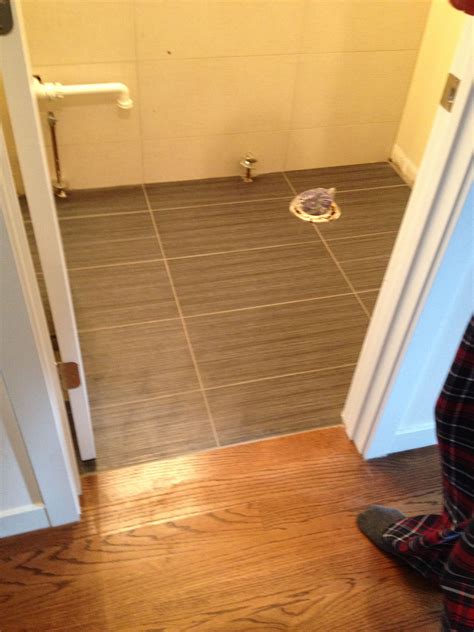 Wall and floor tiles for bathroom. 24x12 porcelain tile we installed in a bathroom in Chicago ...