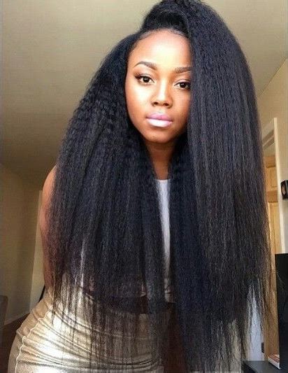 The barber slowly runs a comb down the length of my brown hair. Kinky straight weave is so beautiful! - Black Hair Information