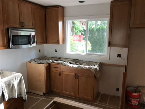 Once the cabinet is free from the wall, you and a partner can lift it down from the support blocks. Pin by Laurel May on Tear Down This Wall | Kitchen ...