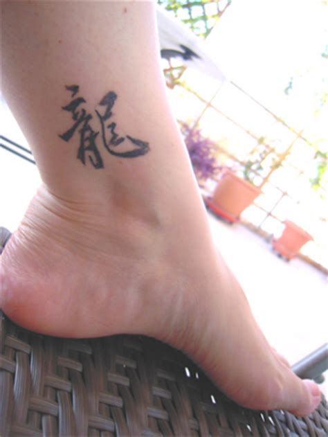 Japanese culture is definitely versatile and rich. Superb Japanese Quote Foot Tattoo Image