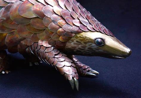 Pangolins look like scaly anteaters. Metal Sculpture: Pangolin