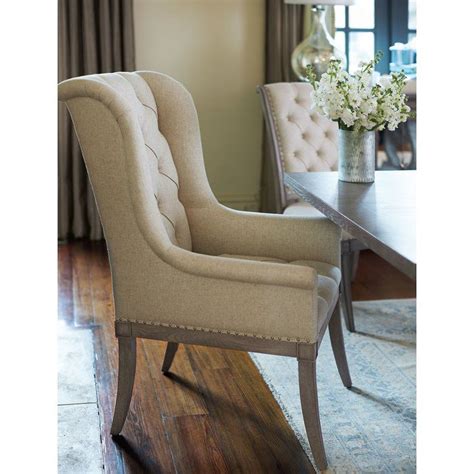 Dining armchairs put you at the head of the table. Marquesa Tufted Upholstered Wingback Arm Chair in Ivory ...