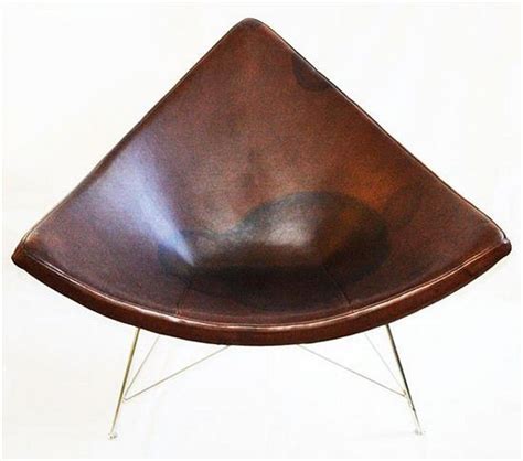 Wear and tear mask available also. A pair of George Nelson coconut chairs, brown leather and ...