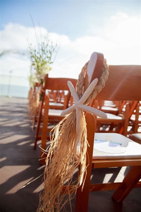 Large conch shells or white shells. Starfish Aisle Decorations