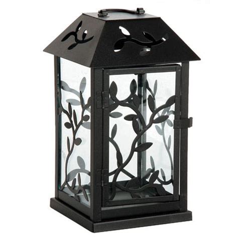 Designed with black rubber stoppers at the base that prevent scratching furniture and table tops, as well as sliding around. Vine silhouettes give this decorative black metal lantern ...