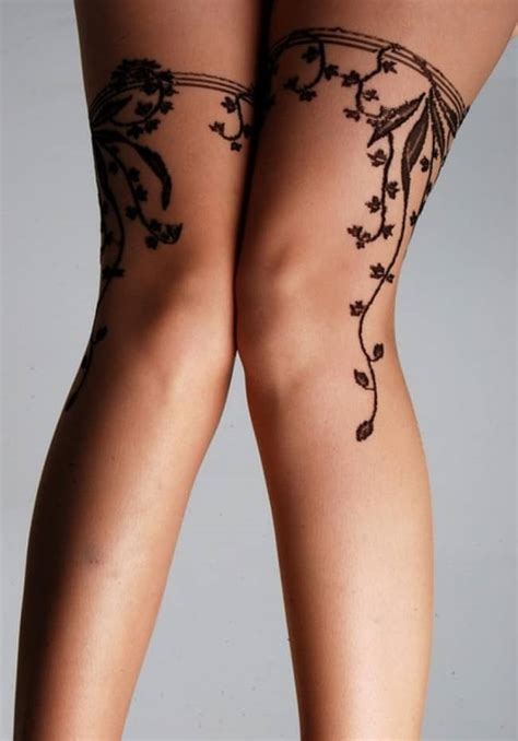 Black and grey gun and belt tattoo on thigh. 100 Sexiest Garter Tattoos (Ultimate Guide, January 2020)