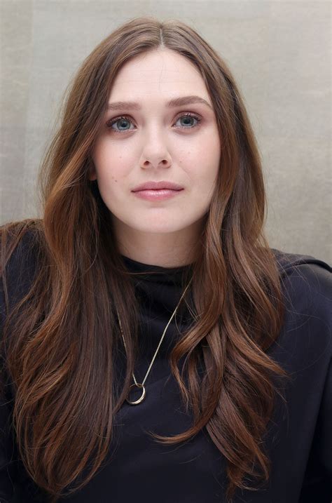 She played elle brody in the 2014 film godzilla and scarlet witch in the 2015 blockbuster avengers: 2014: 'Godzilla' Press Conference - 009 - Elizabeth Olsen ...