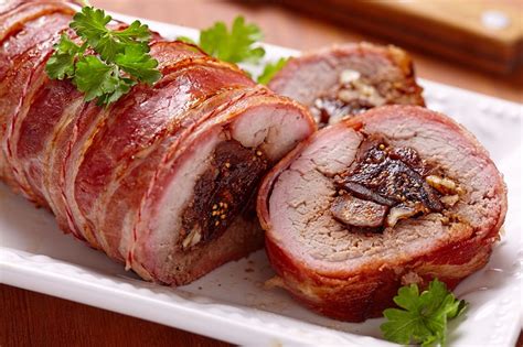 Drizzle the pork skin with a little olive oil and then massage one tablespoon of salt into the skin forcing it into the score marks. This Bacon Wrapped Pork Roast Is Every Bit As Delicious As ...