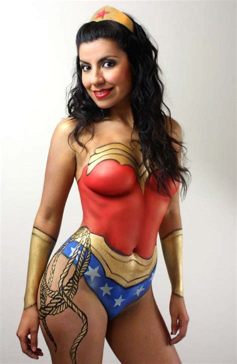 Beauty, plastic surgery, beautiful woman face, beautiful woman skin, beautiful woman beach, sensuality, perfect woman body, fashion, one woman only, fashion model. Starsend: Wonder Woman Body Paint