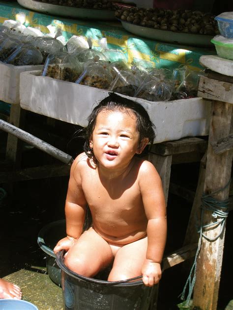 Instead of a baby bathtub, back then your mother might have bathed you and your younger siblings in the same large bucket she would also sometimes use to soak laundry overnight or hold all the potatoes as she peeled them for a big family dinner. Taking a Bath | A kid taking a bath in a bucket on the ...