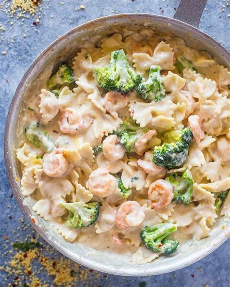 Pan seared garlic shrimp, broccoli and pasta tossed in creamy lightened up garlic alfredo sauce that contains no cream! Pan seared garlic shrimp, broccoli and pasta tossed in ...