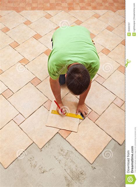 Just make sure the work to be performed and materials to be purchased are included in the written contract. Man Laying Ceramic Floor Tiles Royalty Free Stock ...