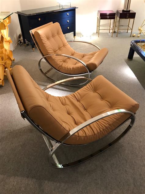 Supported by a black steel frame on 100% solid wood gliders, it features arm and. Pair of Rocking Lounge Chair Metal Leather by Renato Zevi ...