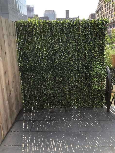 Artificial or living plants, what's the. DIY Bamboo and fake greenery outdoor wall | Wall gardens ...