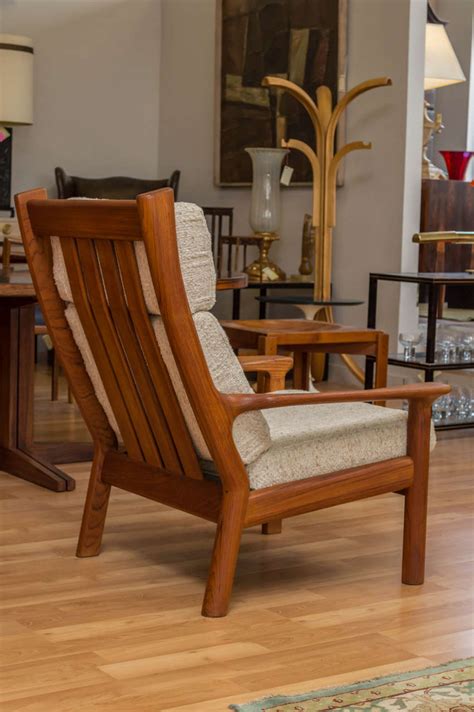 This chair features a solid teak wood frame with loose cushions and eight slats on the open back, creating soft curves for a clean aesthetic. Danish Modern Teak Lounge Chair by Glostrup Mobel Fabrik ...