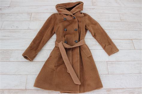 From cole haan, this coat features: Cole Haan Camel Double Breasted Alpaca Wool Coat